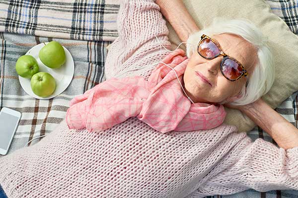 senior woman relaxing on a blanket